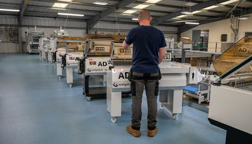 man working machine at adpak
